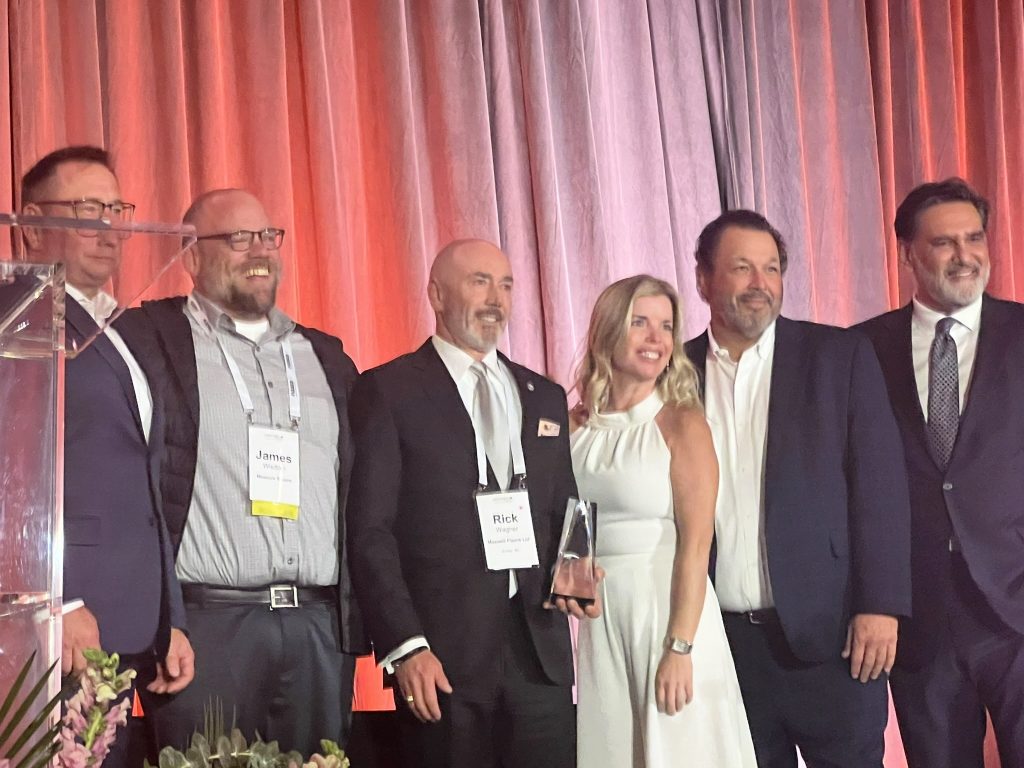 Pictured above: James Wisdom, Senior VP of Strategic Partnerships, accepting the award.